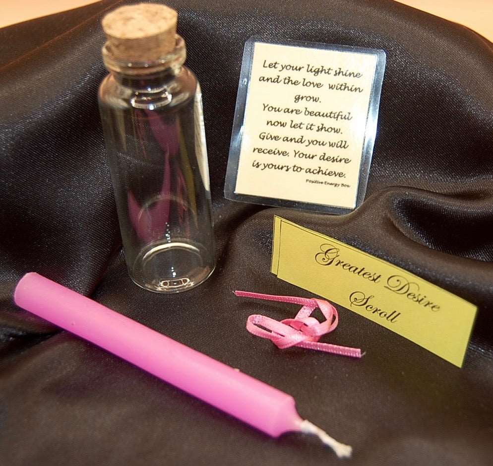 pink wishing candle with glass vial and scroll