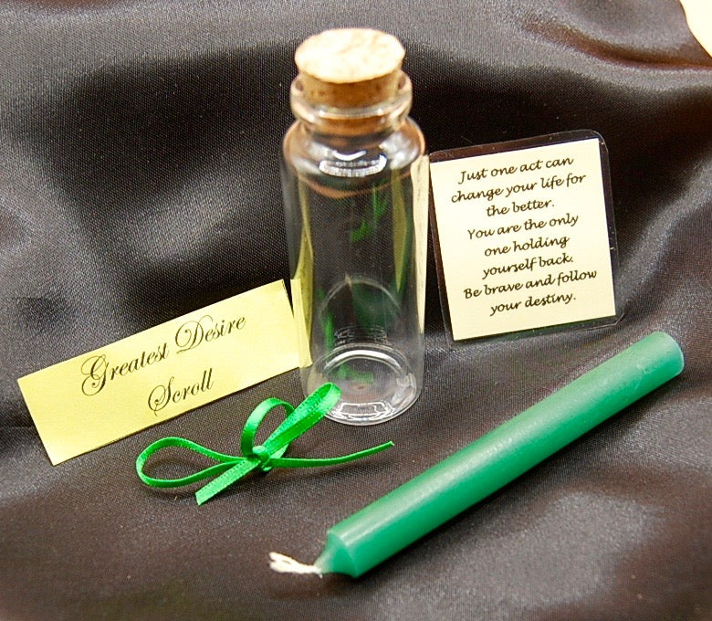 Green wishing candle with a glass vail and a greatest desire scroll